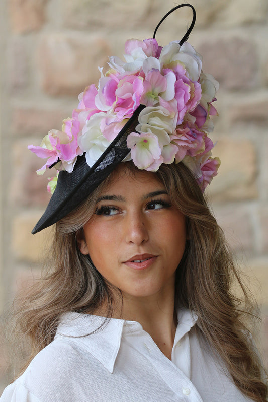 Black sinamay disc with pink and off white flower fascinator